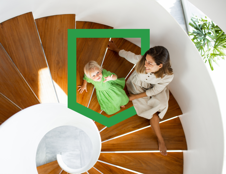 Mother and daughter sitting on spiral staircase